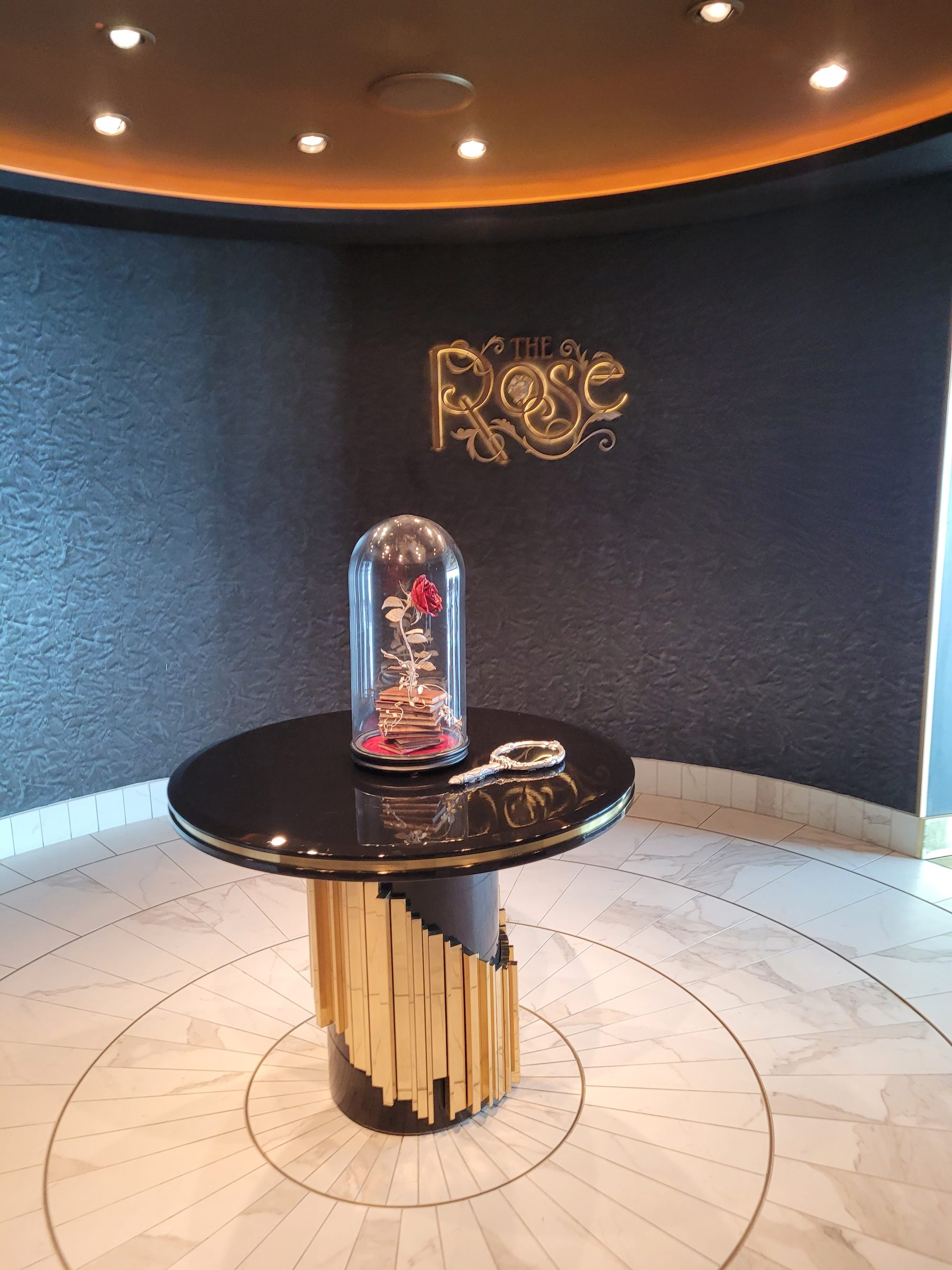 The enchanted rose under glass at the entrance to The Rose and Enchanté